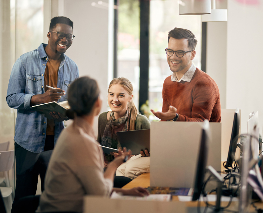 Business Professionals In Office Space Discussing Work