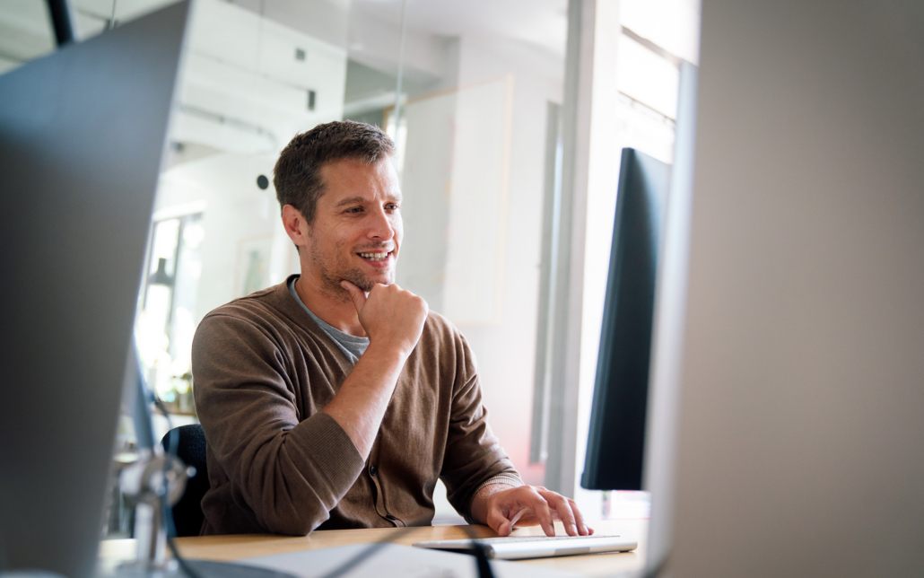Programmer, Web Developer, Designer Working At Office Comparing Mobile And Desktop